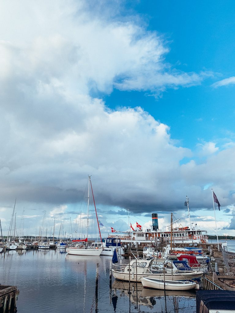 Sailboats with Danish flags in the Roskilde Harbor