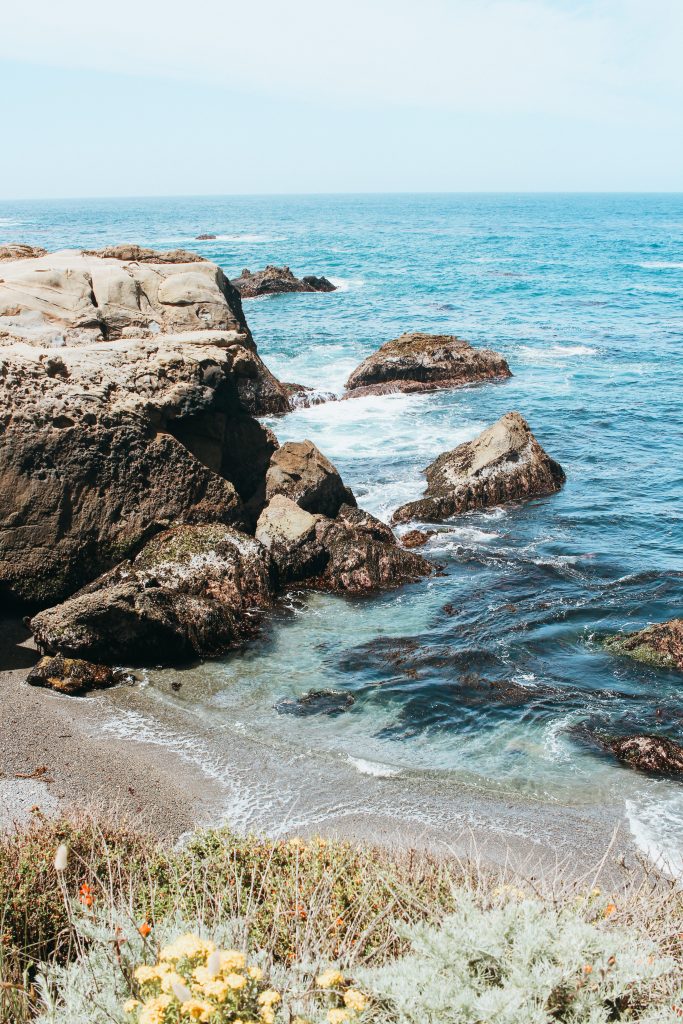 blue ocean water with rocks