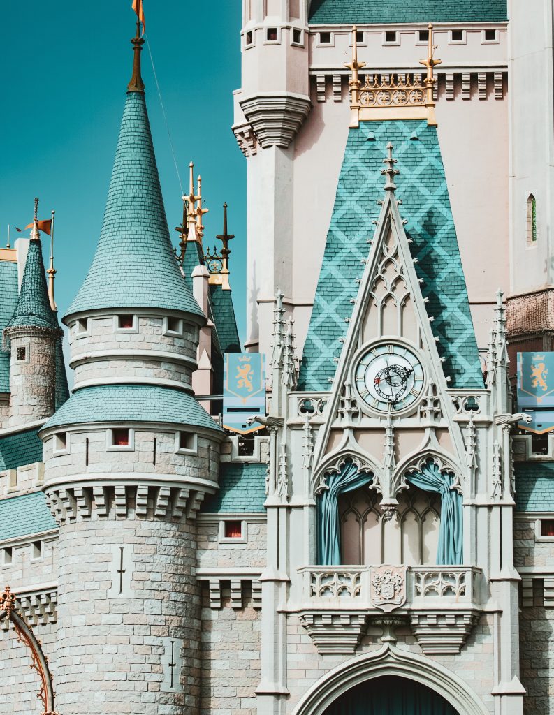 close up image of blue and pink cinderella castle at walt disney world