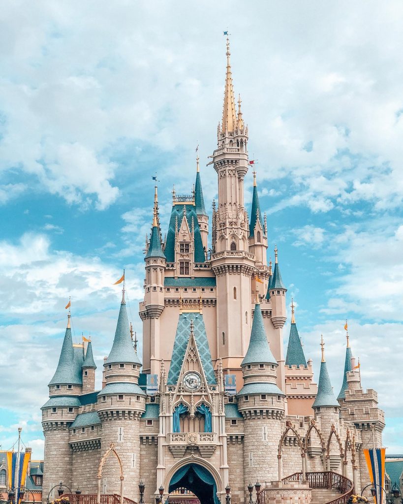 Pastel pink, blue and gold Disney castle at Walt Disney World on a roadtrip in Florida with your family