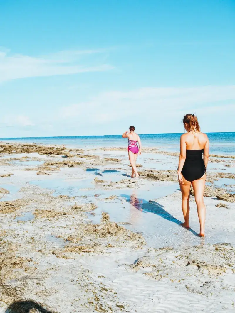 Two woman walk on sandbar in Key West Florida