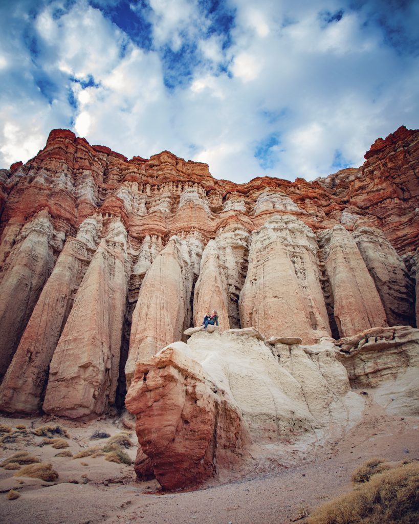 Woman on large red and white rock pillars at Red Rock Canyon California State park