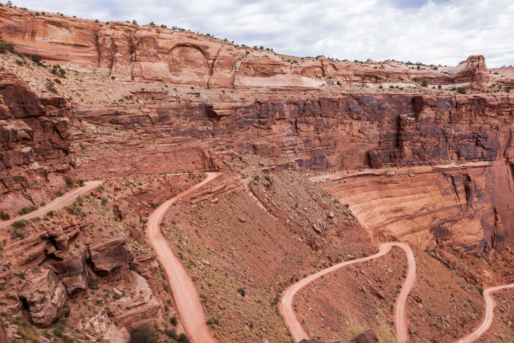 Dirt road leading down sandstone cliffside at Island in the Sky Canyonlands