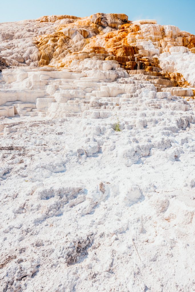 Large hill of white and orange crystallised rocks