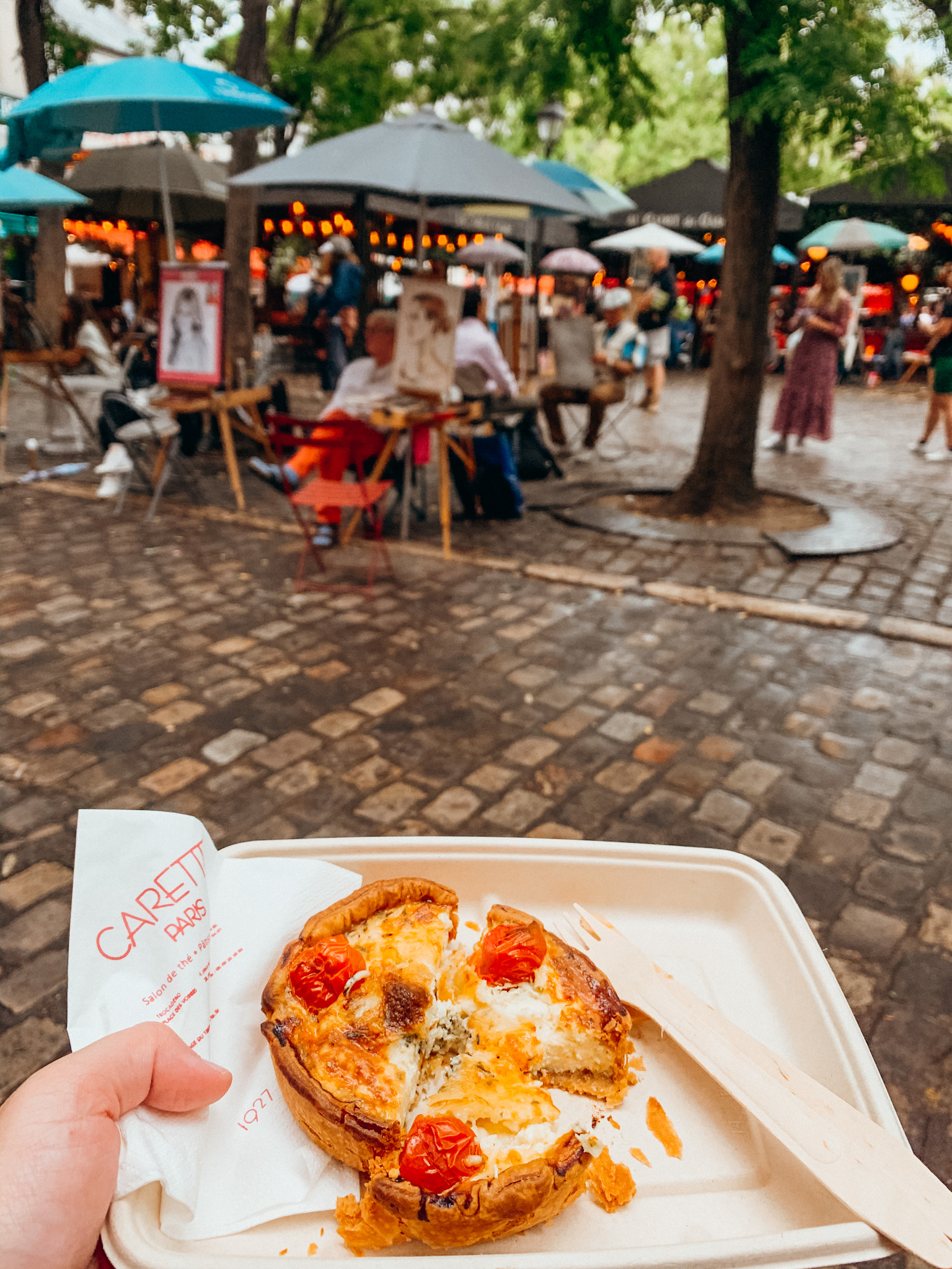 Close up of egg quiche with painters in a square behind