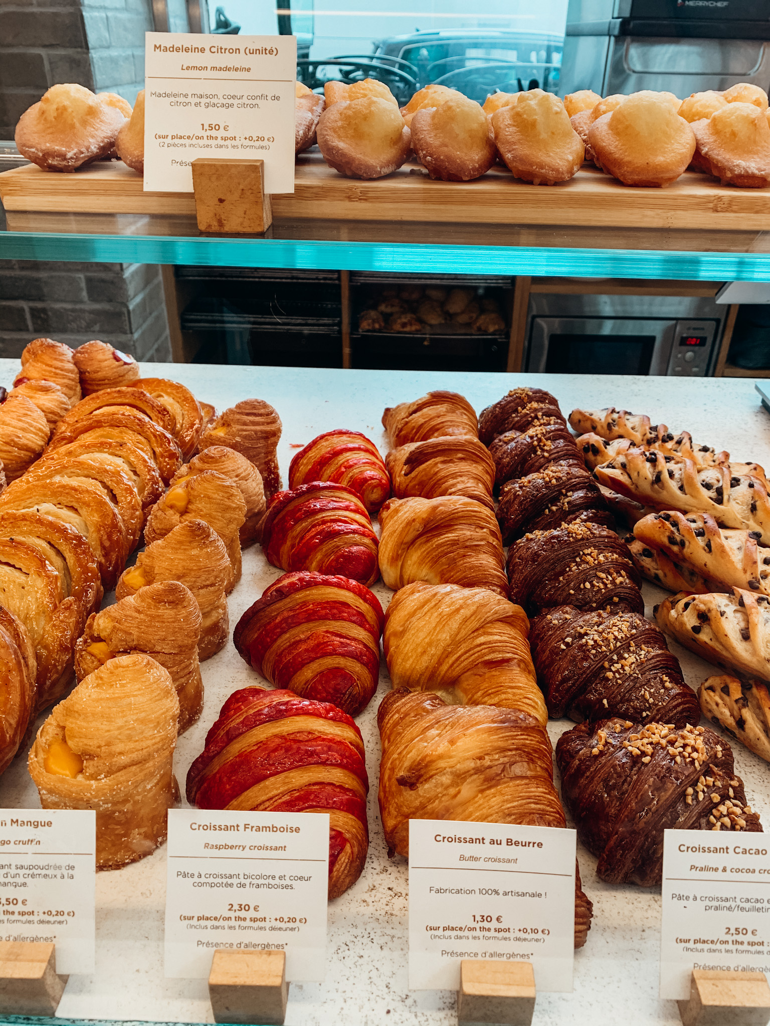 Rows of croissants and other baked goods in Paris