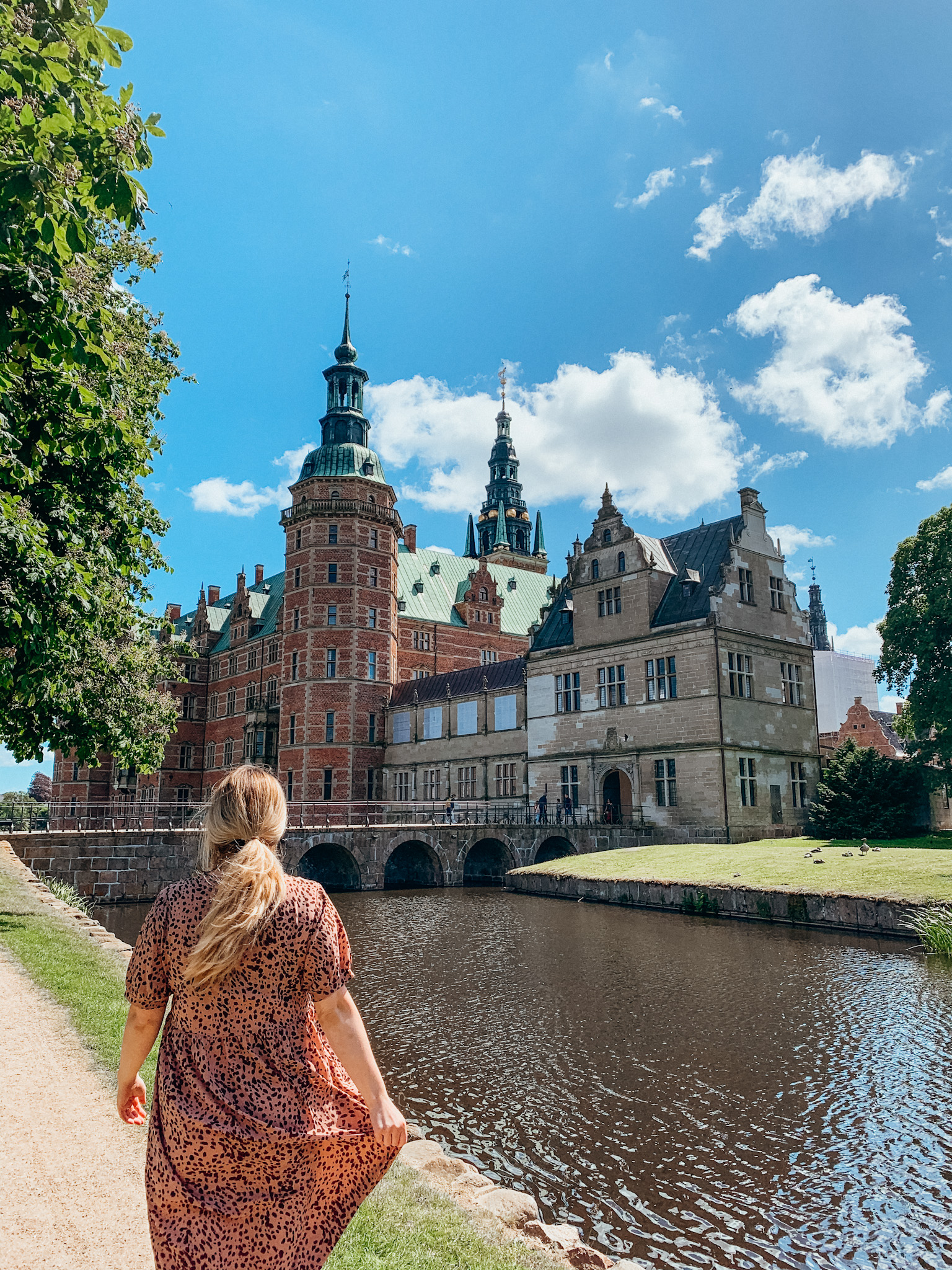 Woman looking at Fredriksborg Castle near Copenhagen