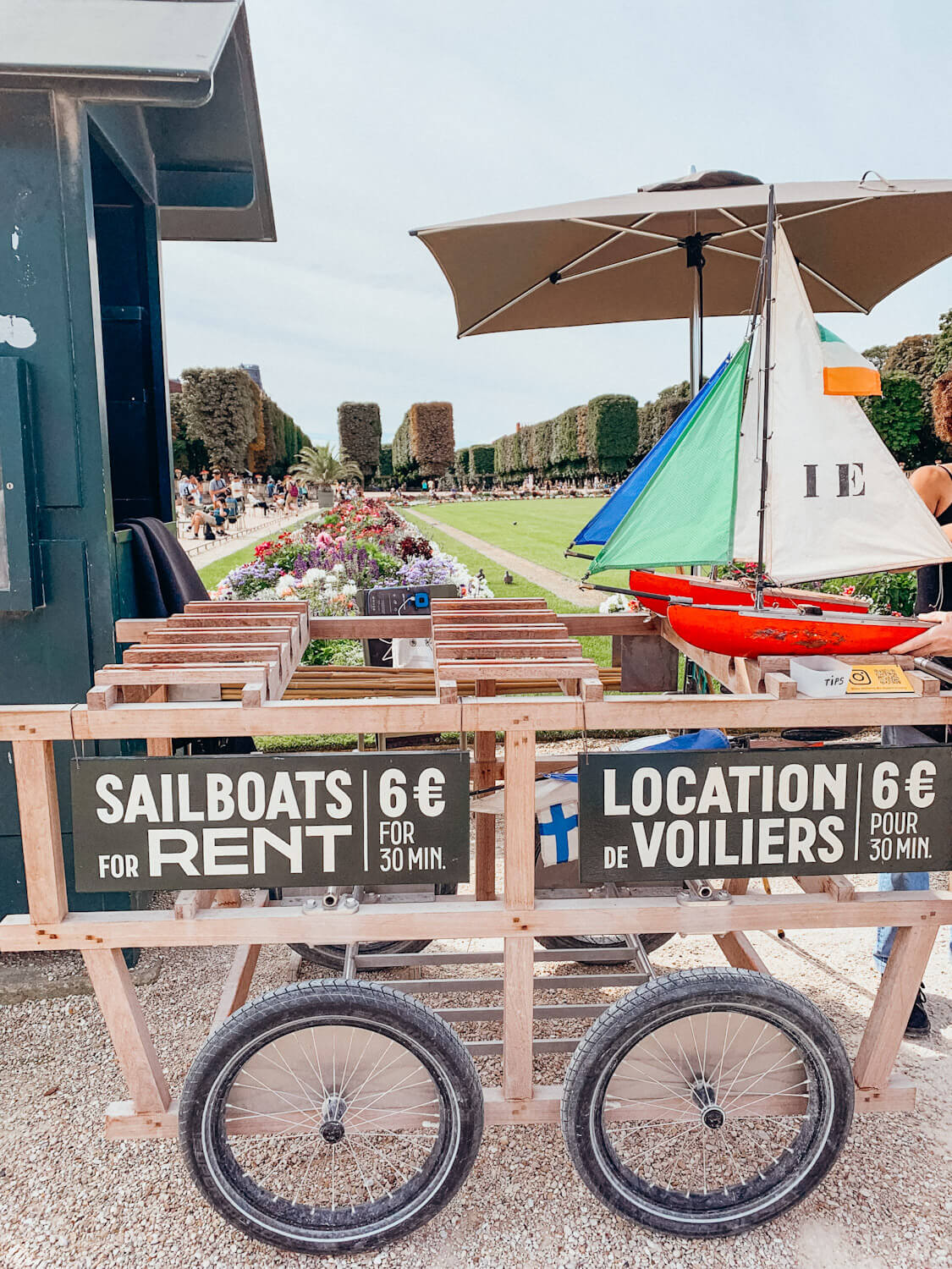 Small stand renting out toy sailboats at Luxembourg Gardens in Paris
