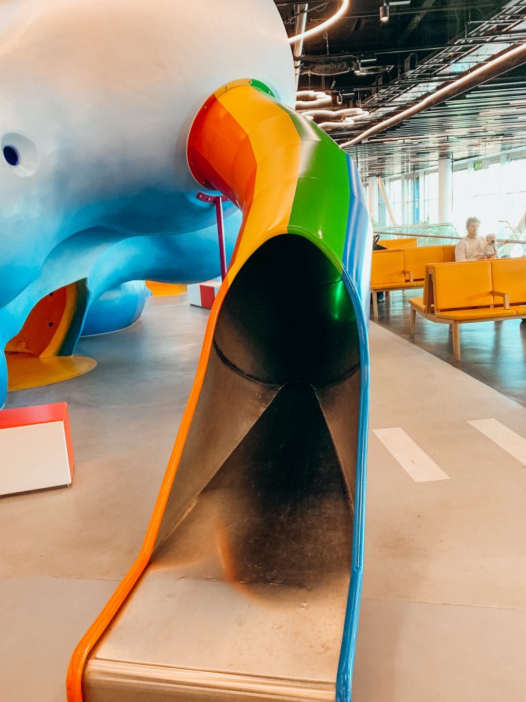 Colorful, striped slide at playground in Amsterdam airport