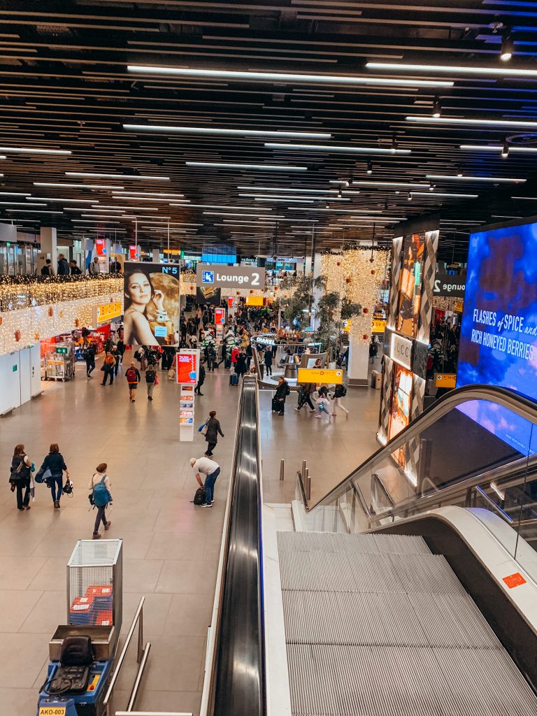 Escalators going down to shopping area in the Amsterdam Schipol airport