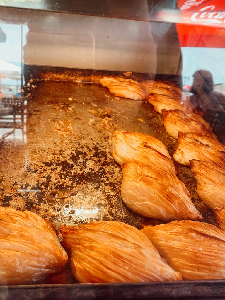 Diamond shaped pastries behind a glass window