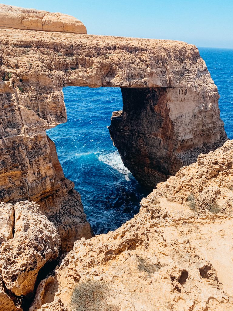Large, limestone arch over the sea
