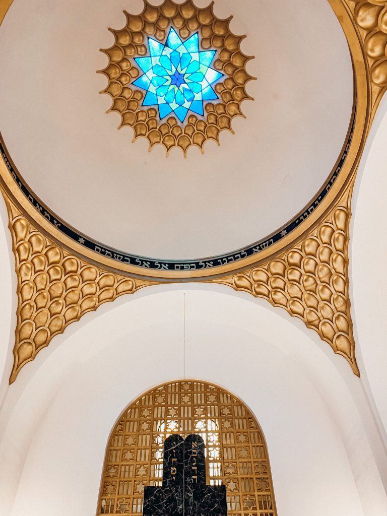 White ceiling with Hebrew lettering and gold trim
