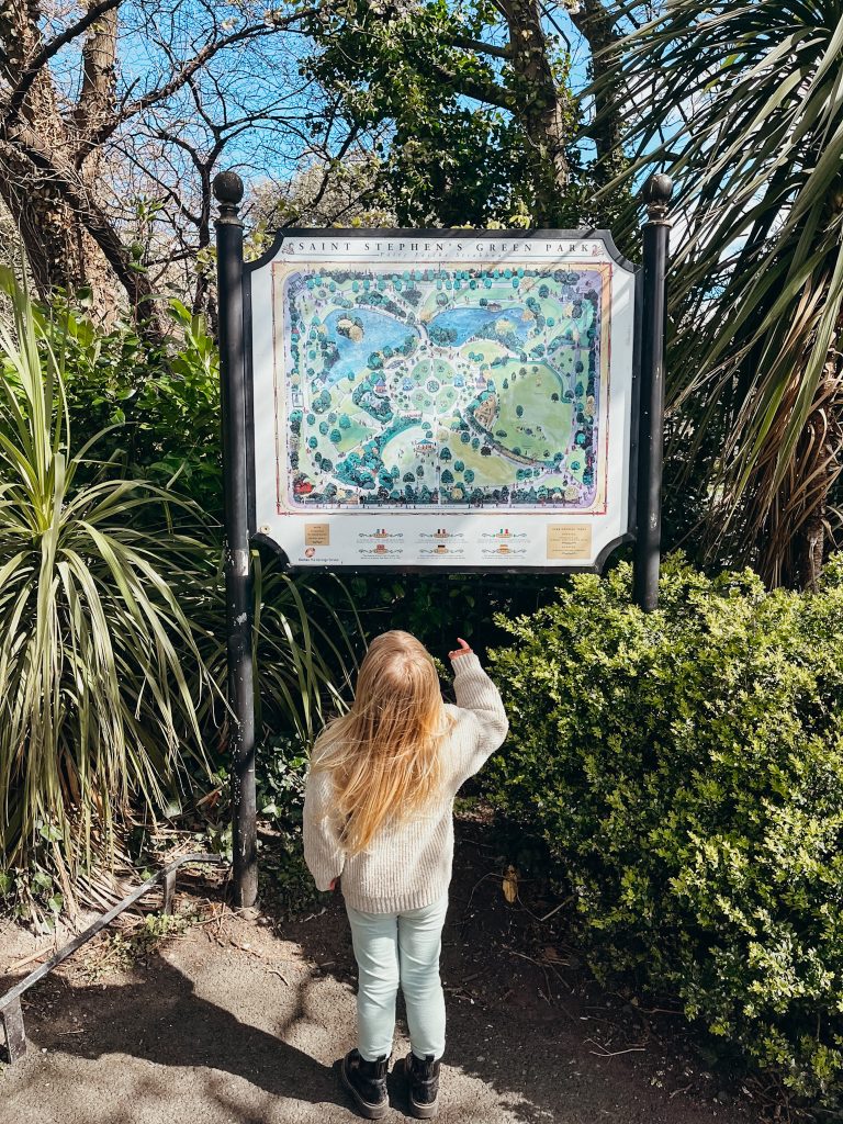 Child looks up at map of St. Stephen's Green