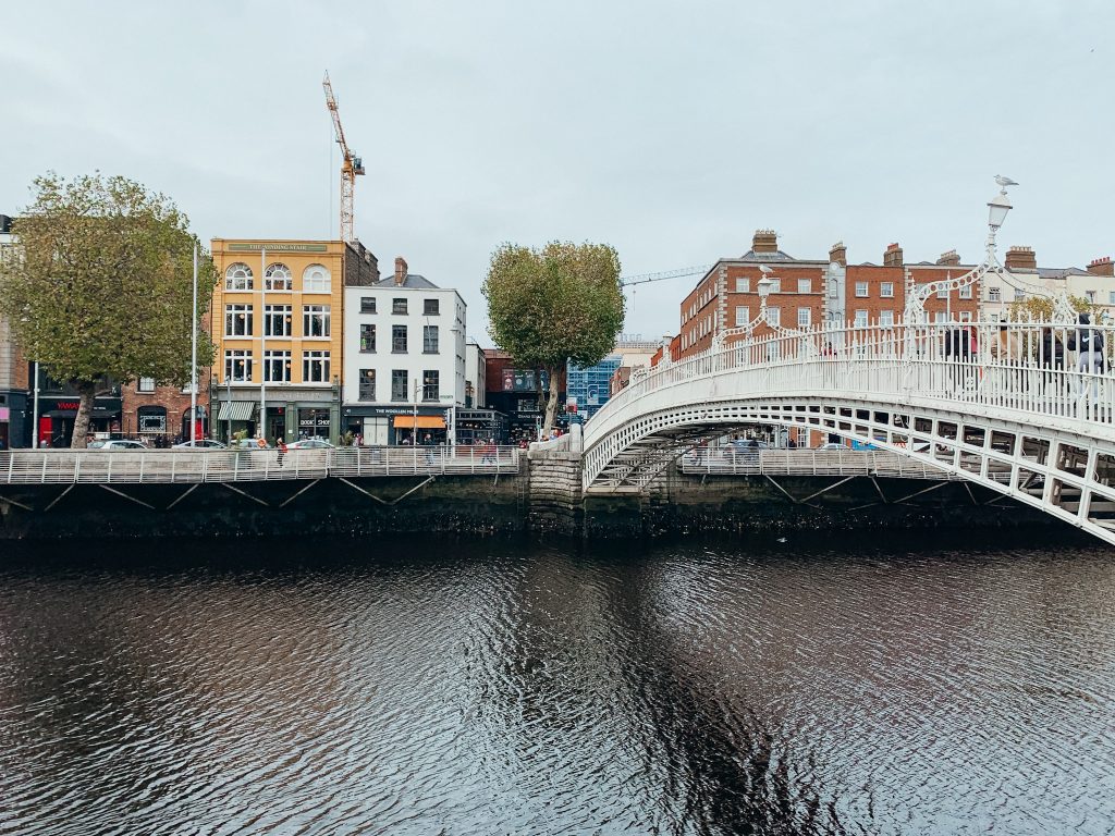 White wrought iron pedestrian bridge crossing a river in Dublin