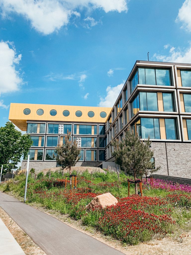 Large buildings with yellow LEGO-like brick on top and grey LEGO pieces on the side