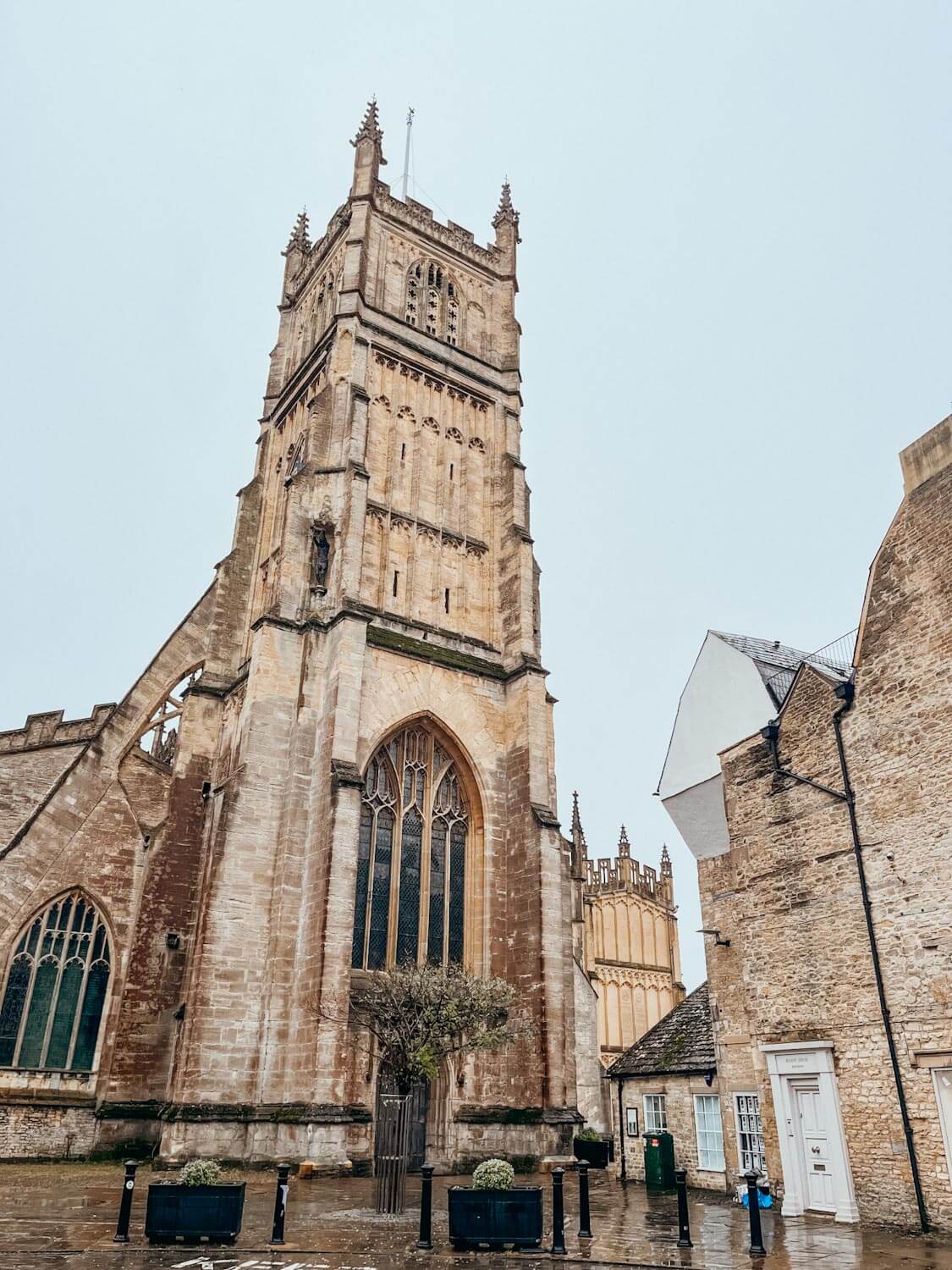 Large brown brick cathedral in Cirencester England