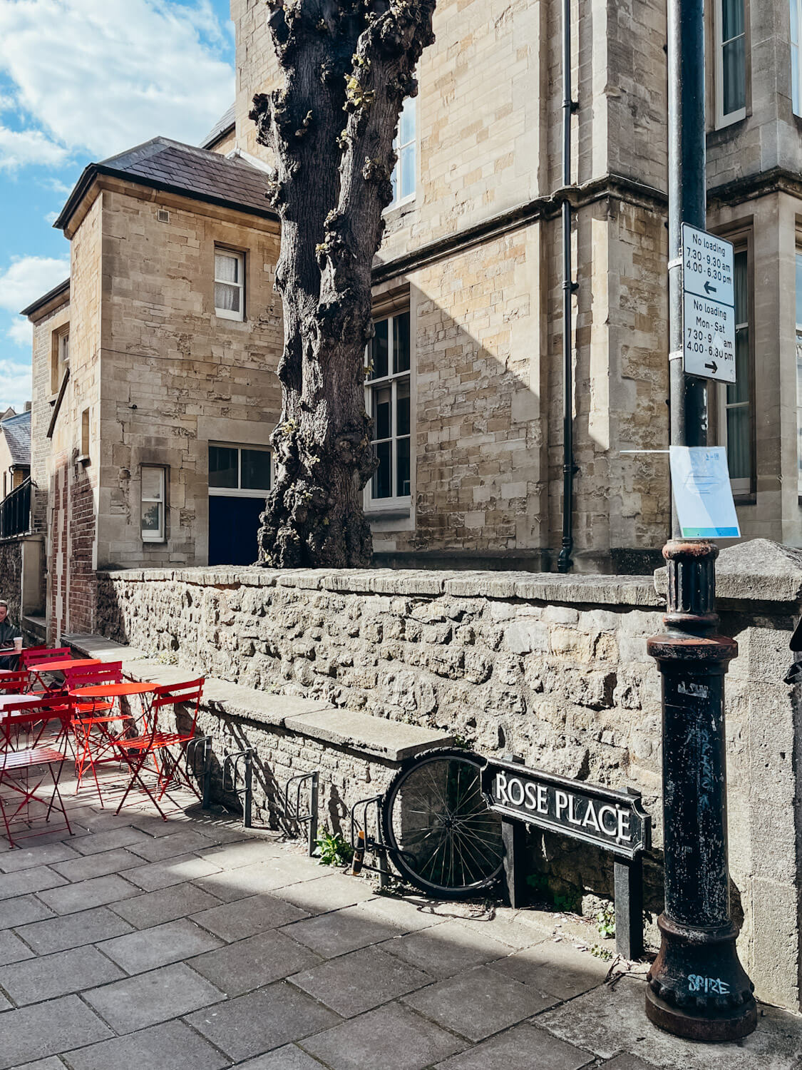 Stone buildings line stone pathway in Oxford