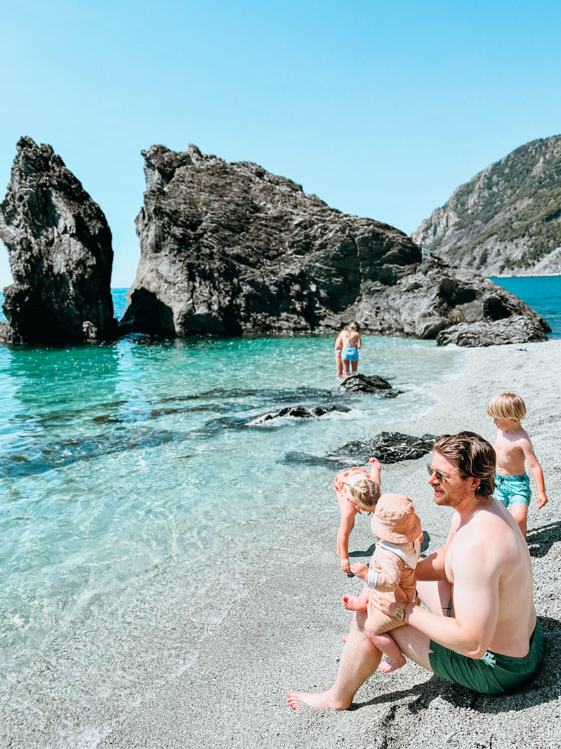 Family playing on Monterosso al Mare Beach in Cinque Terre italy