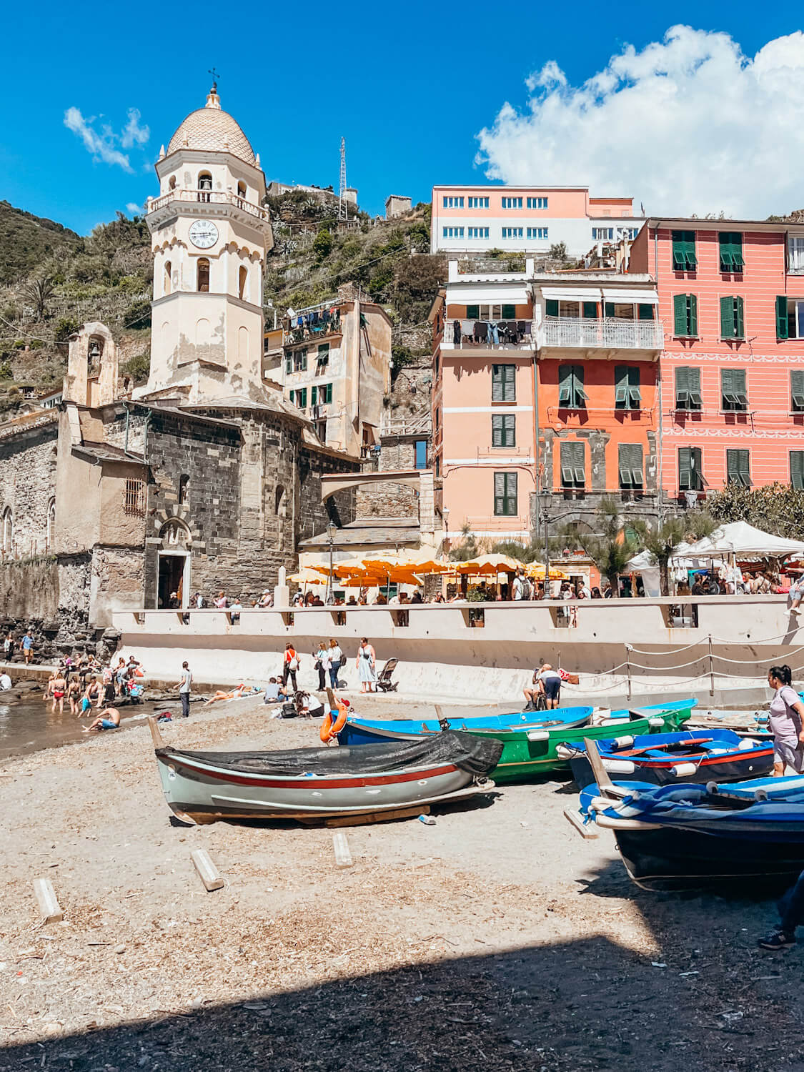Colorful rowboats sit on small beach in the Vernazza Harbor