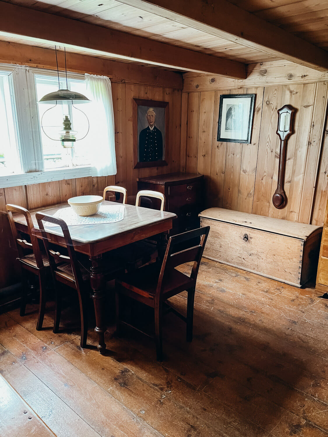 Wooden living room with wooden table and chest and decor from hundreds of years ago in the Faroe 
Islands