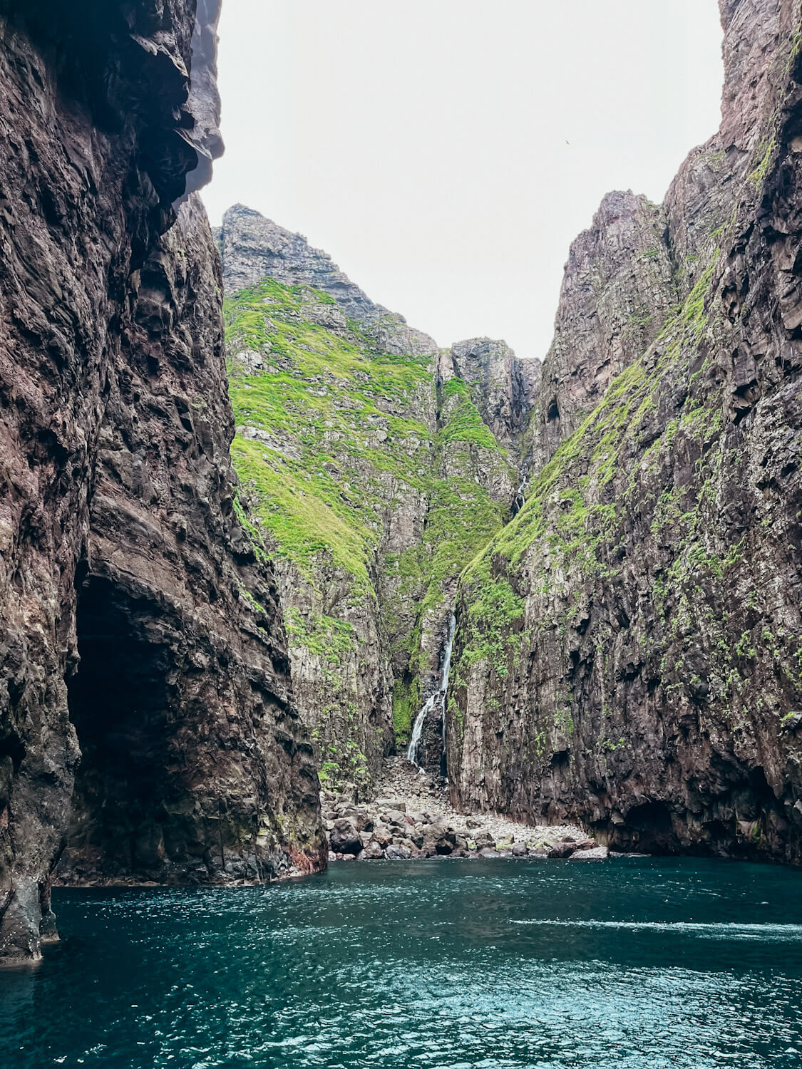 Sea cliffs with a waterfall 