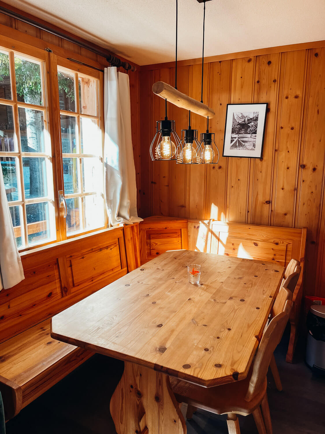 Wooden corner table in the bungalows at Camping Jungfrau