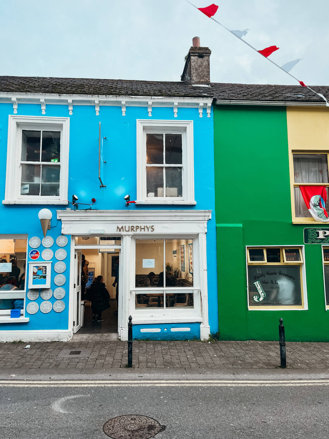 Blue, green and yellow buildings in Dingle Town Ireland