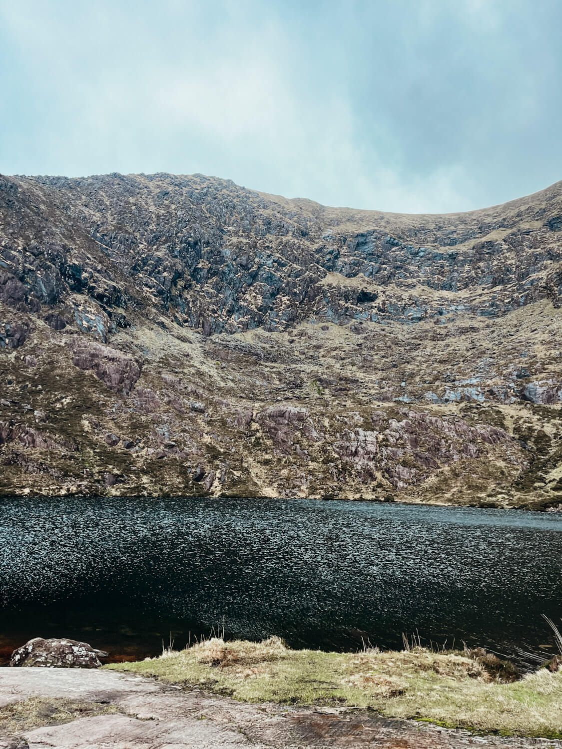 Glacial lake with mountain behind on the Dingle Peninsula