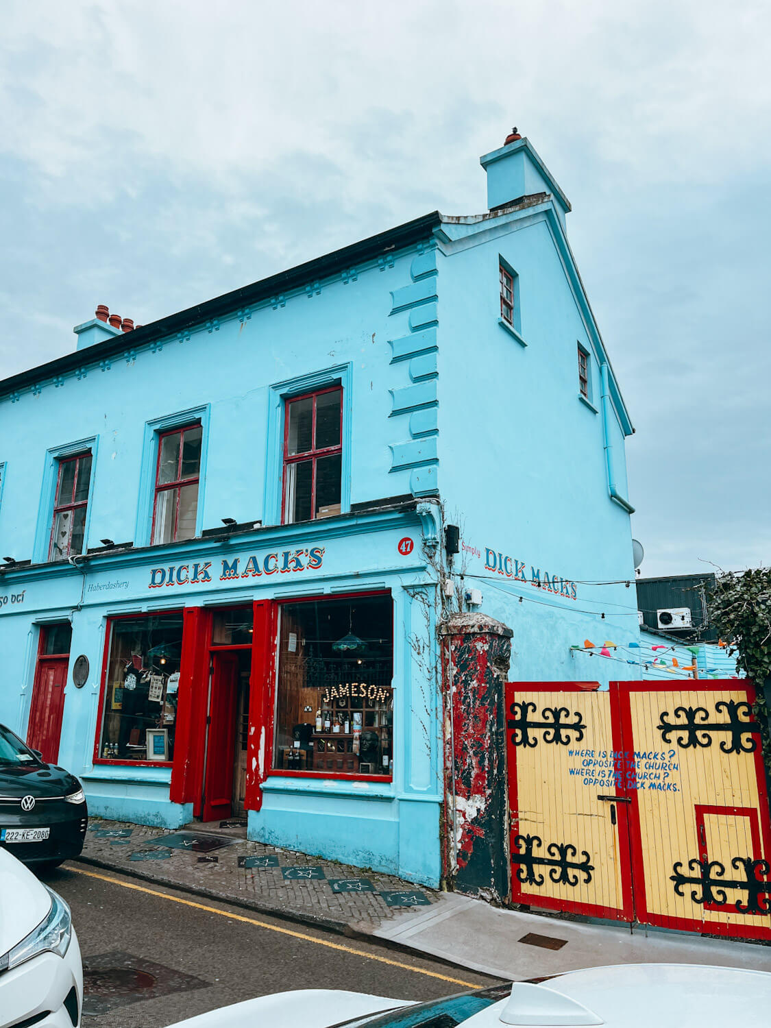 Cute, blue, yellow and red buildings in Dingle Town Ireland