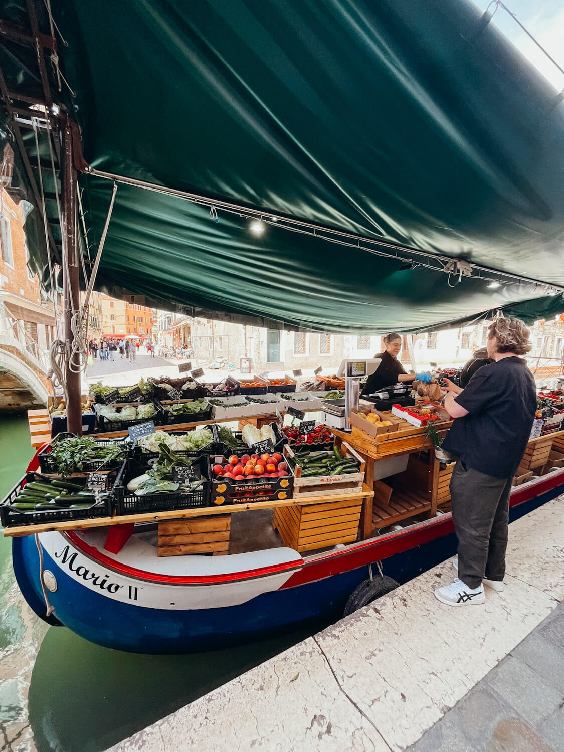 Traditional Venetian boat turned into a fruit stand in Venice