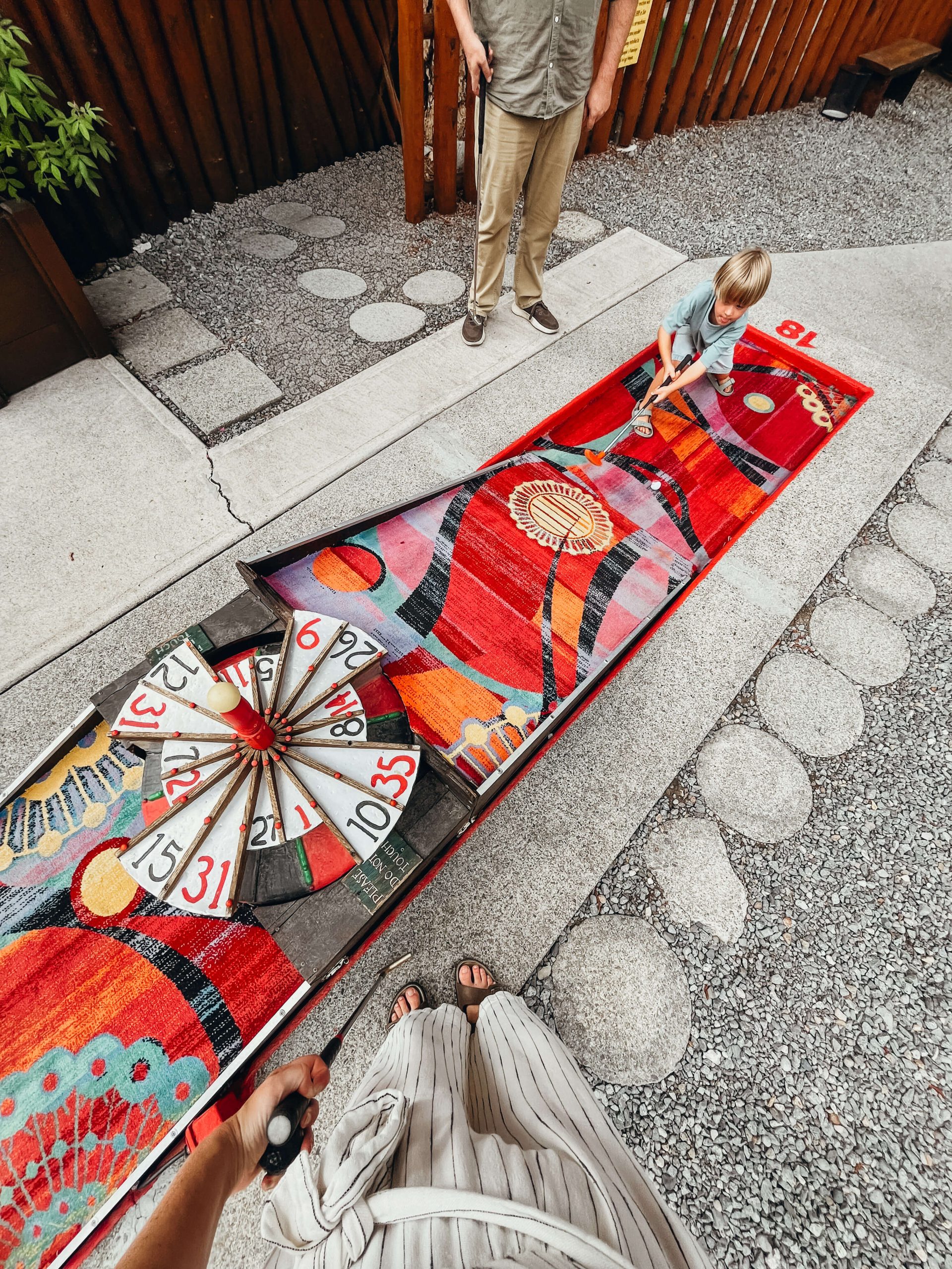 Colorful red carpet with functioning roulette at King's Beach Mini Golf