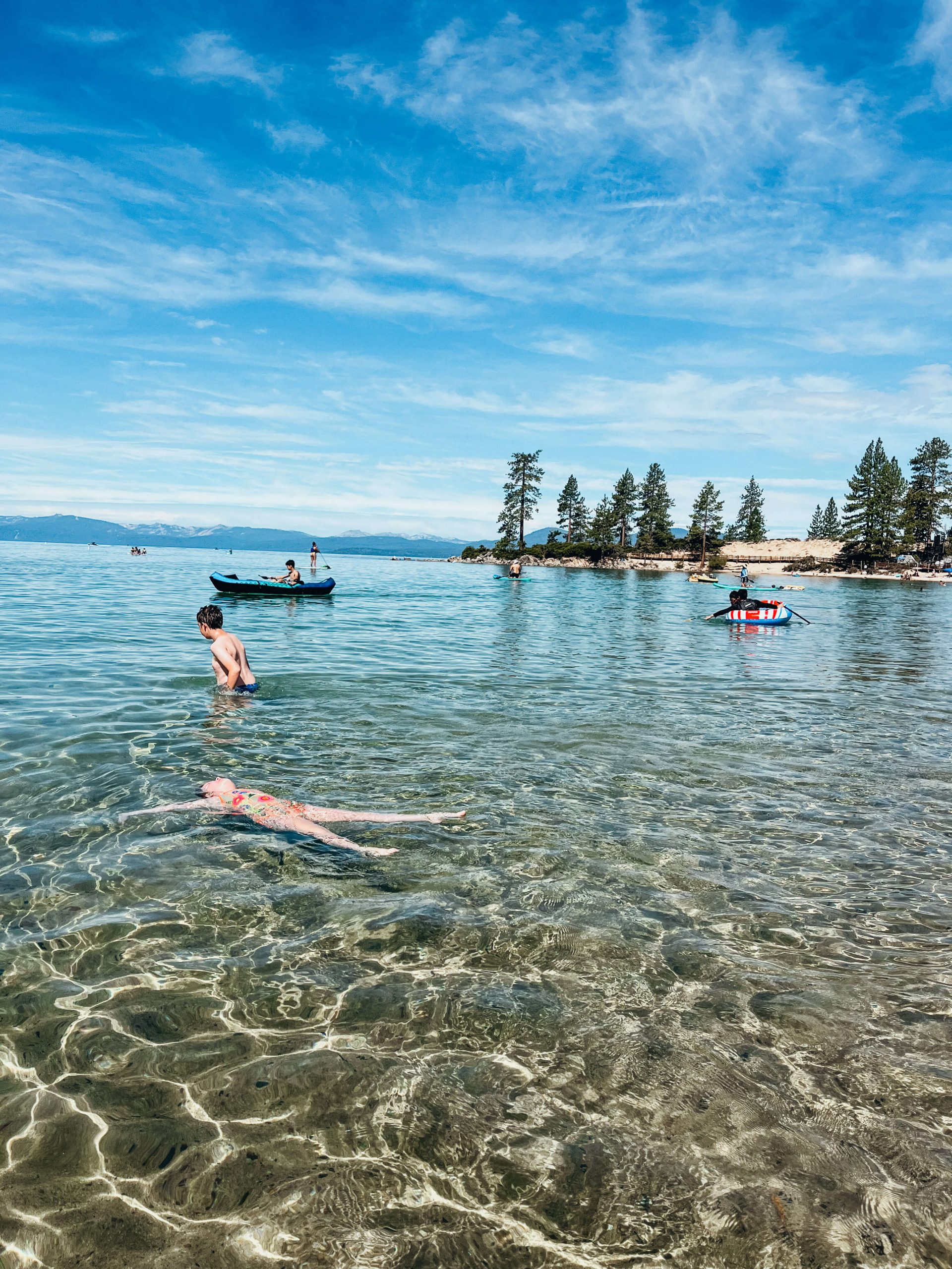 Girls floats in water at Sand Harbor State Park Nevada